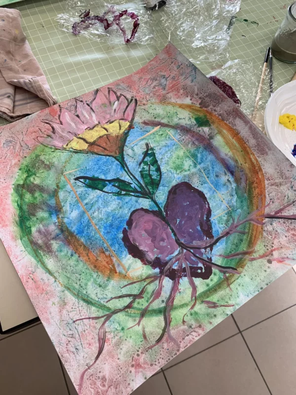 Peinture acrylique sur toile carrée, représentant une fleur qui prend racine dans un cœur